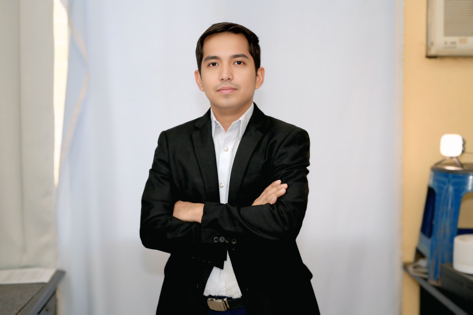 Harris Dela Paz wearing a black suit